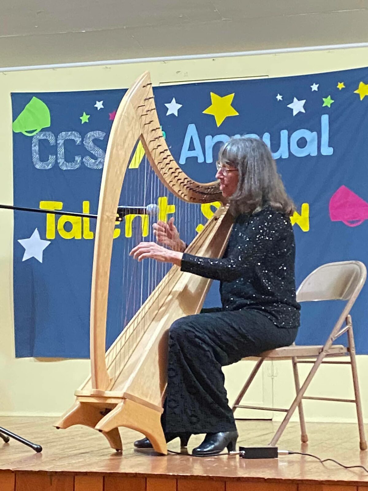 teacher playing harp
